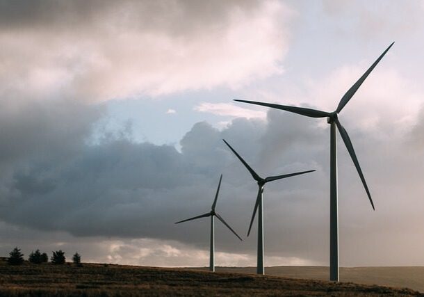 A group of wind turbines in the middle of nowhere.